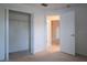 Bedroom featuring an open closet and tan carpet at 5011 Glenburne Dr, Spring Hill, FL 34609