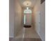 Bright Foyer area features tile flooring and glass front door at 5011 Glenburne Dr, Spring Hill, FL 34609