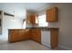 Open kitchen with tile floors, granite countertops, and white appliances at 5011 Glenburne Dr, Spring Hill, FL 34609