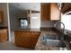 Open kitchen with granite countertops and view to living space at 5011 Glenburne Dr, Spring Hill, FL 34609
