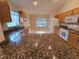 Kitchen with granite counters, stainless steel appliances and window at 5011 Glenburne Dr, Spring Hill, FL 34609