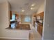 Kitchen with long island, granite counters, and stainless steel appliances at 5011 Glenburne Dr, Spring Hill, FL 34609