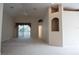 Bright living room with vaulted ceilings and arched doorway at 5011 Glenburne Dr, Spring Hill, FL 34609