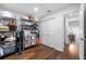 Well-organized storage room with metal shelving units and hardwood floors at 502 Old Mill Pond Rd, Palm Harbor, FL 34683