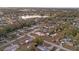 An aerial view of a residential neighborhood with a lake, and lush green landscaping at 506 Coulter Rd, Brandon, FL 33511