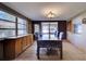 Bright dining room featuring large windows and a stylish light fixture at 5313 Baroque Dr, Holiday, FL 34690