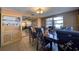 Dining room featuring a dark wooden table and chairs, and a built-in display cabinet at 5313 Baroque Dr, Holiday, FL 34690