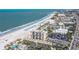 Aerial view of a beachfront high-rise condo and resort with a beautiful coastline at 5396 Gulf Blvd # 1108, St Pete Beach, FL 33706