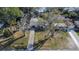 Single-story home nestled in a quiet residential neighborhood featuring mature trees and a well-maintained front yard at 5602 Bay Blvd, Port Richey, FL 34668