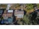 Overhead view of the home with yard, pool, and roofline of the property at 5602 Bay Blvd, Port Richey, FL 34668