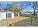 Backyard features healthy lawn, shed and potential for outdoor activities at 5602 Bay Blvd, Port Richey, FL 34668