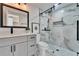 Bathroom showcasing a marble shower, modern vanity, and stylish fixtures at 5602 Bay Blvd, Port Richey, FL 34668