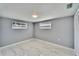 Bedroom featuring new floors, neutral paint, closet and natural light at 5602 Bay Blvd, Port Richey, FL 34668