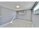 Bedroom featuring new floors, neutral paint, closet and natural light at 5602 Bay Blvd, Port Richey, FL 34668