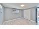 A neutral painted bedroom with marble floors, a closet and a window at 5602 Bay Blvd, Port Richey, FL 34668