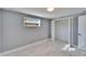 Bedroom featuring new floors, neutral paint, closet and natural light at 5602 Bay Blvd, Port Richey, FL 34668