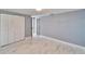 This bedroom features marble floors, a closet and neutral paint at 5602 Bay Blvd, Port Richey, FL 34668