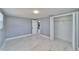 Bedroom features marble floors, a large closet, and an adjacent doorway at 5602 Bay Blvd, Port Richey, FL 34668