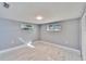 This bedroom features marble floors, a large window and a closet for storage at 5602 Bay Blvd, Port Richey, FL 34668