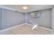 Cozy bedroom featuring a large window, marble floors, and neutral paint at 5602 Bay Blvd, Port Richey, FL 34668