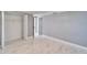 This bedroom features marble floors, a closet and neutral paint at 5602 Bay Blvd, Port Richey, FL 34668