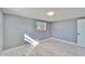 Bedroom features marble floors, window for natural lighting, and fresh paint at 5602 Bay Blvd, Port Richey, FL 34668