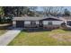 Charming home featuring stone accents, well-maintained landscaping, and an inviting entrance at 5602 Bay Blvd, Port Richey, FL 34668