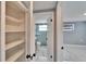 Hallway view of remodeled bathroom with new floors, vanity and shower at 5602 Bay Blvd, Port Richey, FL 34668