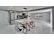 Bright kitchen features stainless steel appliances, marble counters and backsplash and a large island with seating at 5602 Bay Blvd, Port Richey, FL 34668