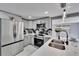Bright kitchen features stainless steel appliances, marble counters and backsplash and a large island with seating at 5602 Bay Blvd, Port Richey, FL 34668