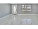 Bright living room with marble floors, fresh paint, new doors and new windows at 5602 Bay Blvd, Port Richey, FL 34668