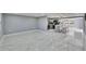 Bright, open-concept living space features new marble floors, modern finishes, and lots of natural light at 5602 Bay Blvd, Port Richey, FL 34668