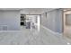 Large living area featuring marble floors, neutral gray walls and an open floor plan at 5602 Bay Blvd, Port Richey, FL 34668