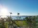 Waterfront backyard with palm trees and beautiful bay views at 561 173Rd E Ave, North Redington Beach, FL 33708