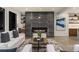 Modern living room with a fireplace, sleek furniture, and large artwork at 561 173Rd E Ave, North Redington Beach, FL 33708