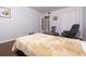 Bedroom with carpeted floors, a closet, comfortable chair and picture on wall at 6015 19Th N St # 115, St Petersburg, FL 33714