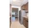 Well-lit kitchen featuring wood cabinets and stainless-steel appliances at 6015 19Th N St # 115, St Petersburg, FL 33714