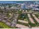 Aerial view of the community showing the many attached homes and a pond with water feature at 628 Arbor Lake Ln, Tampa, FL 33602