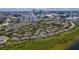 Aerial view of the community showing the many attached homes with trees and downtown Tampa in the background at 628 Arbor Lake Ln, Tampa, FL 33602
