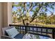 Balcony with an outdoor view overlooking the lake and lush landscape at 628 Arbor Lake Ln, Tampa, FL 33602