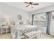 Serene bedroom with neutral tones, patterned bedding, and soft lighting creates a peaceful retreat at 628 Arbor Lake Ln, Tampa, FL 33602