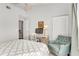 Comfortable bedroom featuring a bed, desk, chair, and large window with natural light at 628 Arbor Lake Ln, Tampa, FL 33602