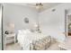 Bright bedroom featuring neutral decor, a comfortable bed with soft pillows, and stylish bedside tables at 628 Arbor Lake Ln, Tampa, FL 33602