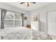 Bright bedroom with a comfortable bed, ample natural light from a large window, and calming decor at 628 Arbor Lake Ln, Tampa, FL 33602