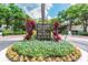 Landscaped entrance to Island Place and Island Walk with stone signage and well-maintained greenery at 628 Arbor Lake Ln, Tampa, FL 33602