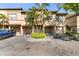 Townhomes featuring garages and well-kept landscaping at 628 Arbor Lake Ln, Tampa, FL 33602