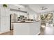 Bright kitchen featuring white cabinets, stainless steel appliances, and granite countertops at 628 Arbor Lake Ln, Tampa, FL 33602