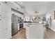 Open living area with a stainless steel refrigerator, microwave, and stove at 628 Arbor Lake Ln, Tampa, FL 33602