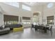 Bright clubhouse lounge area with high ceilings, comfortable seating, and a dining table at 628 Arbor Lake Ln, Tampa, FL 33602