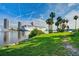 Waterfront scene with cruise ship, downtown buildings, palm trees, and a green lawn at 628 Arbor Lake Ln, Tampa, FL 33602